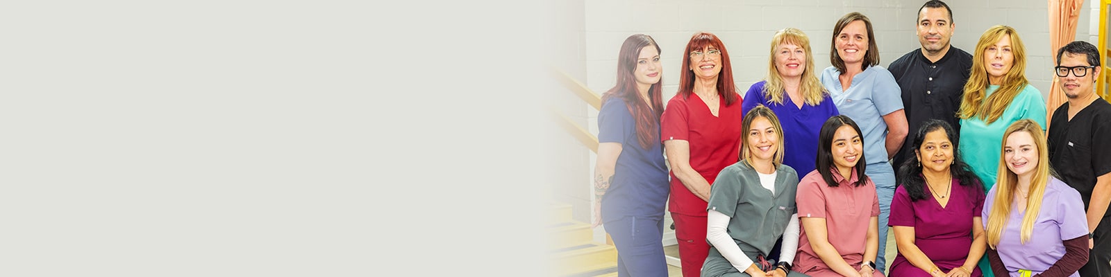 smiling employees in the rehab gym at sherwood oaks