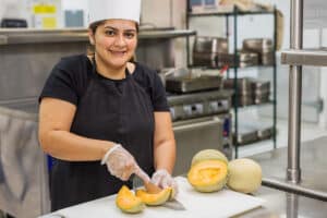 chef slicing cantalope
