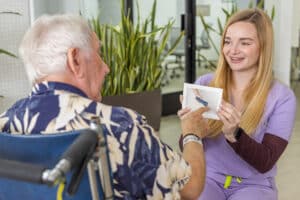 rehab nurse going through flashcards with elderly resident
